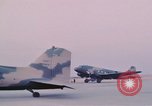Image of camouflaged AC 47 aircraft Vietnam Bien Hoa Air Base, 1967, second 43 stock footage video 65675052032