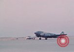 Image of camouflaged AC 47 aircraft Vietnam Bien Hoa Air Base, 1967, second 45 stock footage video 65675052032