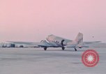 Image of camouflaged AC 47 aircraft Vietnam Bien Hoa Air Base, 1967, second 47 stock footage video 65675052032