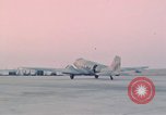 Image of camouflaged AC 47 aircraft Vietnam Bien Hoa Air Base, 1967, second 49 stock footage video 65675052032