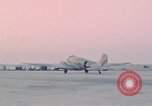 Image of camouflaged AC 47 aircraft Vietnam Bien Hoa Air Base, 1967, second 50 stock footage video 65675052032