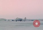 Image of camouflaged AC 47 aircraft Vietnam Bien Hoa Air Base, 1967, second 55 stock footage video 65675052032