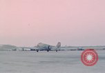 Image of camouflaged AC 47 aircraft Vietnam Bien Hoa Air Base, 1967, second 56 stock footage video 65675052032