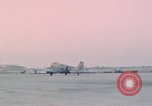 Image of camouflaged AC 47 aircraft Vietnam Bien Hoa Air Base, 1967, second 57 stock footage video 65675052032