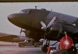 Image of camouflaged AC 47 aircraft Vietnam Bien Hoa Air Base, 1967, second 1 stock footage video 65675052033