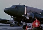 Image of camouflaged AC 47 aircraft Vietnam Bien Hoa Air Base, 1967, second 4 stock footage video 65675052033