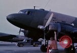 Image of camouflaged AC 47 aircraft Vietnam Bien Hoa Air Base, 1967, second 8 stock footage video 65675052033