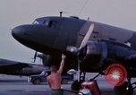 Image of camouflaged AC 47 aircraft Vietnam Bien Hoa Air Base, 1967, second 10 stock footage video 65675052033