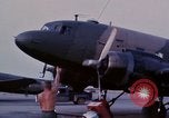 Image of camouflaged AC 47 aircraft Vietnam Bien Hoa Air Base, 1967, second 11 stock footage video 65675052033