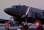 Image of camouflaged AC 47 aircraft Vietnam Bien Hoa Air Base, 1967, second 12 stock footage video 65675052033