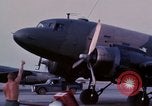 Image of camouflaged AC 47 aircraft Vietnam Bien Hoa Air Base, 1967, second 13 stock footage video 65675052033