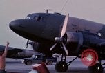 Image of camouflaged AC 47 aircraft Vietnam Bien Hoa Air Base, 1967, second 14 stock footage video 65675052033