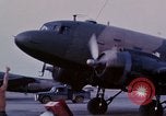 Image of camouflaged AC 47 aircraft Vietnam Bien Hoa Air Base, 1967, second 15 stock footage video 65675052033