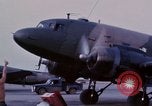 Image of camouflaged AC 47 aircraft Vietnam Bien Hoa Air Base, 1967, second 16 stock footage video 65675052033