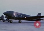 Image of camouflaged AC 47 aircraft Vietnam Bien Hoa Air Base, 1967, second 25 stock footage video 65675052033