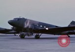 Image of camouflaged AC 47 aircraft Vietnam Bien Hoa Air Base, 1967, second 27 stock footage video 65675052033