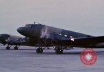 Image of camouflaged AC 47 aircraft Vietnam Bien Hoa Air Base, 1967, second 29 stock footage video 65675052033
