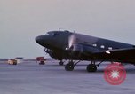 Image of camouflaged AC 47 aircraft Vietnam Bien Hoa Air Base, 1967, second 31 stock footage video 65675052033