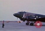 Image of camouflaged AC 47 aircraft Vietnam Bien Hoa Air Base, 1967, second 33 stock footage video 65675052033