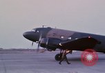 Image of camouflaged AC 47 aircraft Vietnam Bien Hoa Air Base, 1967, second 35 stock footage video 65675052033