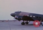 Image of camouflaged AC 47 aircraft Vietnam Bien Hoa Air Base, 1967, second 36 stock footage video 65675052033