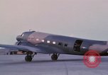 Image of camouflaged AC 47 aircraft Vietnam Bien Hoa Air Base, 1967, second 39 stock footage video 65675052033