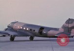 Image of camouflaged AC 47 aircraft Vietnam Bien Hoa Air Base, 1967, second 40 stock footage video 65675052033