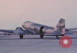 Image of camouflaged AC 47 aircraft Vietnam Bien Hoa Air Base, 1967, second 42 stock footage video 65675052033