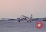 Image of camouflaged AC 47 aircraft Vietnam Bien Hoa Air Base, 1967, second 47 stock footage video 65675052033