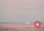 Image of camouflaged AC 47 aircraft Vietnam Bien Hoa Air Base, 1967, second 55 stock footage video 65675052033