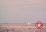 Image of camouflaged AC 47 aircraft Vietnam Bien Hoa Air Base, 1967, second 56 stock footage video 65675052033