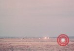 Image of camouflaged AC 47 aircraft Vietnam Bien Hoa Air Base, 1967, second 57 stock footage video 65675052033