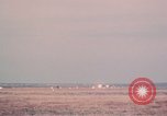 Image of camouflaged AC 47 aircraft Vietnam Bien Hoa Air Base, 1967, second 61 stock footage video 65675052033