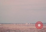 Image of camouflaged AC 47 aircraft Vietnam Bien Hoa Air Base, 1967, second 62 stock footage video 65675052033