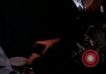 Image of crewman aboard AC 47 aircraft Vietnam Bien Hoa Air Base, 1967, second 36 stock footage video 65675052034