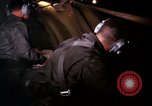 Image of crewman aboard AC 47 aircraft Vietnam Bien Hoa Air Base, 1967, second 57 stock footage video 65675052034