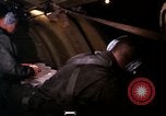 Image of crewman aboard AC 47 aircraft Vietnam Bien Hoa Air Base, 1967, second 58 stock footage video 65675052034