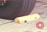 Image of camouflaged AC 47 Vietnam Bien Hoa Air Base, 1967, second 4 stock footage video 65675052035