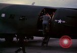 Image of camouflaged AC 47 Vietnam Bien Hoa Air Base, 1967, second 28 stock footage video 65675052035