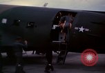 Image of camouflaged AC 47 Vietnam Bien Hoa Air Base, 1967, second 29 stock footage video 65675052035