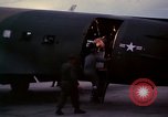 Image of camouflaged AC 47 Vietnam Bien Hoa Air Base, 1967, second 33 stock footage video 65675052035