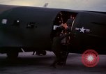 Image of camouflaged AC 47 Vietnam Bien Hoa Air Base, 1967, second 35 stock footage video 65675052035