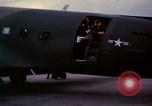 Image of camouflaged AC 47 Vietnam Bien Hoa Air Base, 1967, second 43 stock footage video 65675052035