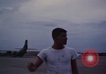 Image of camouflaged AC 47 Vietnam Bien Hoa Air Base, 1967, second 48 stock footage video 65675052035