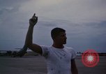Image of camouflaged AC 47 Vietnam Bien Hoa Air Base, 1967, second 53 stock footage video 65675052035
