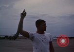 Image of camouflaged AC 47 Vietnam Bien Hoa Air Base, 1967, second 54 stock footage video 65675052035