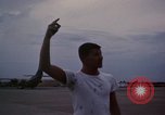 Image of camouflaged AC 47 Vietnam Bien Hoa Air Base, 1967, second 56 stock footage video 65675052035