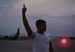 Image of camouflaged AC 47 Vietnam Bien Hoa Air Base, 1967, second 58 stock footage video 65675052035