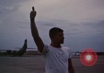 Image of camouflaged AC 47 Vietnam Bien Hoa Air Base, 1967, second 59 stock footage video 65675052035