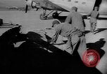 Image of C-47 aircraft dropping propaganda leaflets Korea, 1950, second 13 stock footage video 65675052163